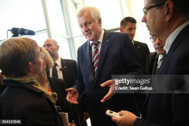 Bavarian Governor and leader of the Bavarian Christian Democrats Horst Seehofer speaks to the media following a meeting of the CSU and German...