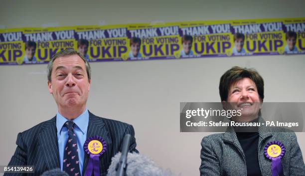 Leader Nigel Farage congratulates their candidate Diane James on coming second in the Eastleigh by-election after holding a news conference in the...