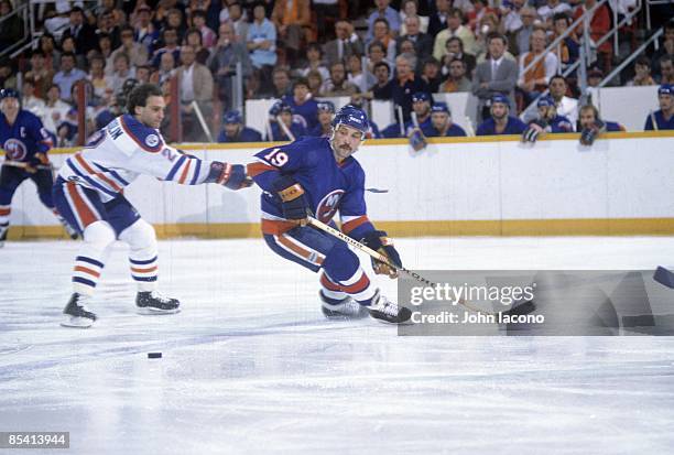 New York Islanders Bryan Trottier in action vs Edmonton Oilers Lee Fogolin . Game 1. Edmonton, Canada 5/10/1983 CREDIT: John Iacono