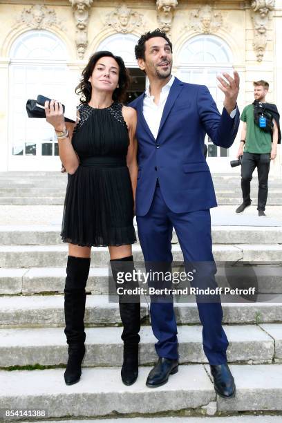 Tomer Sisley and Sandra Zeitoun attend the Christian Dior show as part of the Paris Fashion Week Womenswear Spring/Summer 2018 on September 26, 2017...