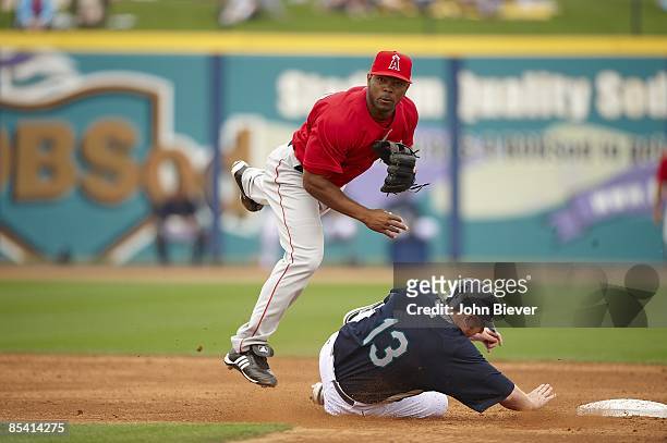 Los Angeles Angels of Anaheim Howie Kendrick in action, turning double play vs Seattle Mariners Chris Shelton during spring training. Peoria, AZ...