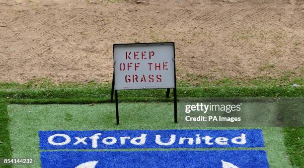 General view of a 'Keep Off The Grass' sign at the Kassam Stadium, Oxford.