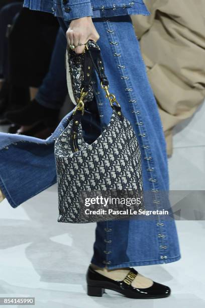 Model, bag detail, walks the runway during the Christian Dior show as part of the Paris Fashion Week Womenswear Spring/Summer 2018 on September 26,...