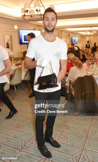 Model displays auction lots at the 4th annual Ladies' Lunch in support of the Silent No More Gynaecological Cancer Fund at Fortnum & Mason on...