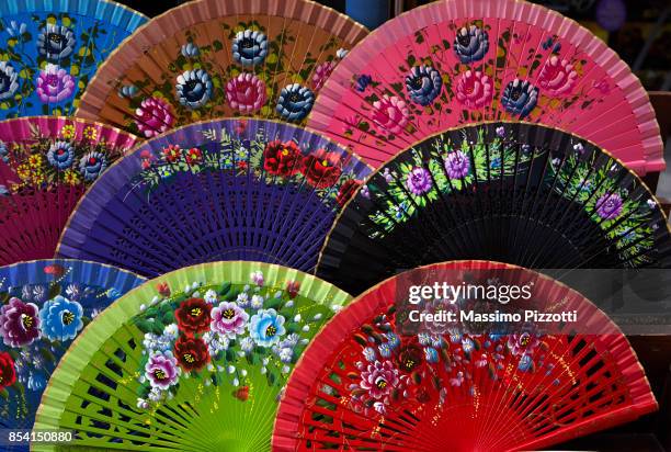 traditional colored andalusian fans - massimo pizzotti fotografías e imágenes de stock