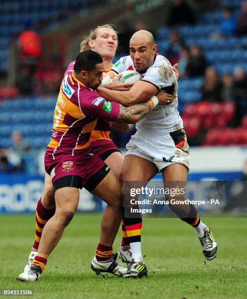 Bradford Bulls' Chev Walker is tackled by Huddersfield Giants' Eorl Crabtree and David Faiumu during the Super League match at the John Smith's...