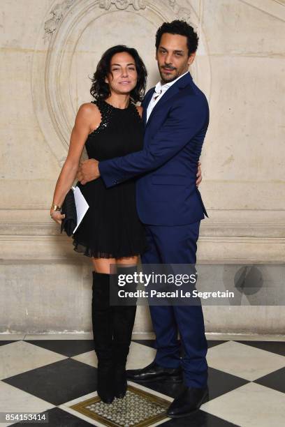 Tomer Sisley and Sandra Zeitoun attend the Christian Dior show as part of the Paris Fashion Week Womenswear Spring/Summer 2018 on September 26, 2017...