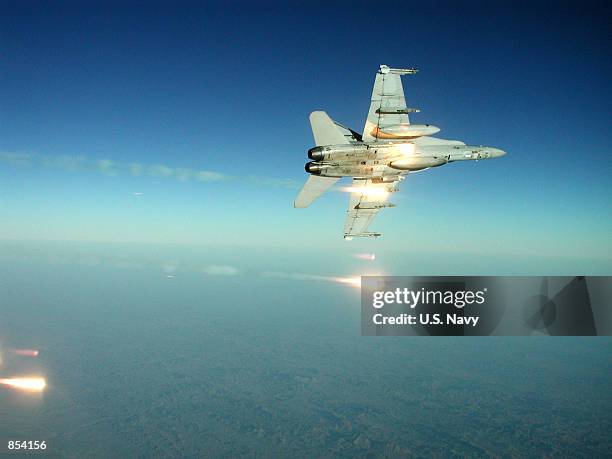 An F/A-18 "Hornet" fires flares October 31, 2001 during a training mission. Flares are part of the aircraft's defense against surface-to-air and...