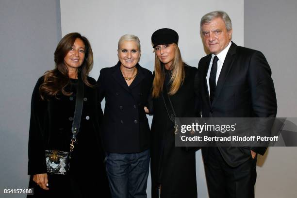 Stylist Maria Grazia Chiuri standing between CEO Dior Sidney Toledano, his wife Katia Toledano and their Daughter Julia pose backstage after the...