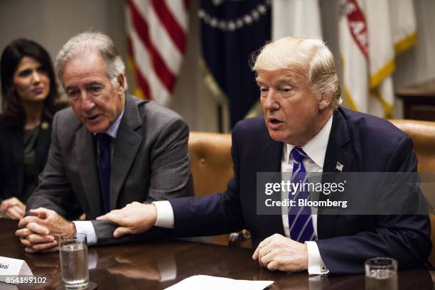 President Donald Trump, right, speaks while Representative Richard Neal, a Democrat from Massachusetts and ranking member of the House Ways and Means...