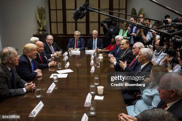 President Donald Trump, second left, speaks during a bipartisan meeting with members of the House Committee on Ways and Means in the Roosevelt Room...