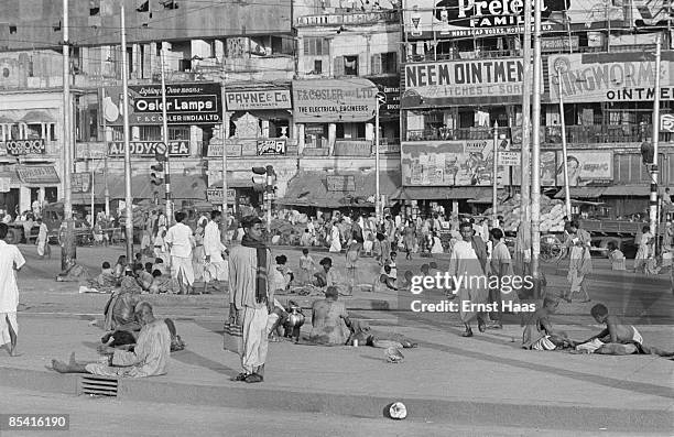 Advertisements line a street in Calcutta, 1954.