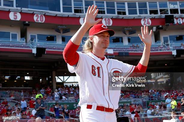 Bronson Arroyo of the Cincinnati Reds walks on to the field where he is honored for his career prior to the start of the game against the Boston Red...