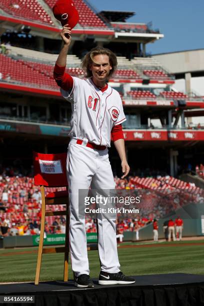 Bronson Arroyo of the Cincinnati Reds waves to the fans as he is honored for his career prior to the start of the game against the Boston Red Sox at...