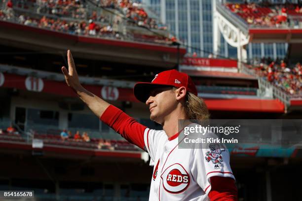 Bronson Arroyo of the Cincinnati Reds waves to the fans as he is honored for his career prior to the start of the game against the Boston Red Sox at...