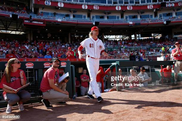 Bronson Arroyo of the Cincinnati Reds walks on to the field where he is honored for his career prior to the start of the game against the Boston Red...