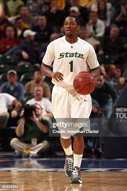 Kalin Lucas of the Michigan State Spartans brings the ball up court against the Minnesota Golden Gophers during the second round of the Big Ten Men's...