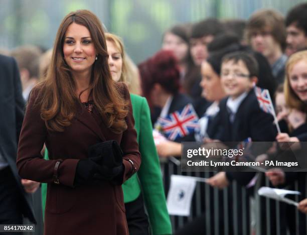 The Duchess of Cambridge is greeted by children from Havelock Academy, Grimsby, during her visit to the town.