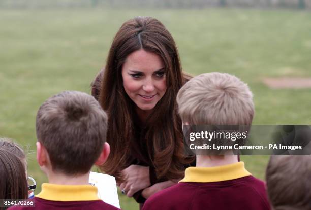 The Duchess of Cambridge is greeted by children from Havelock Academy, Grimsby, during her visit to the town.