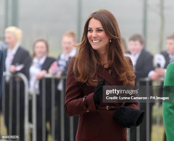 The Duchess of Cambridge is greeted by children from Havelock Academy, Grimsby, during her visit to the town.