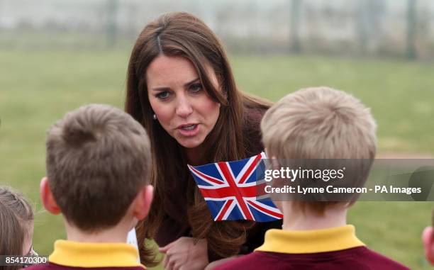 The Duchess of Cambridge is greeted by children from Havelock Academy, Grimsby, during her visit to the town.