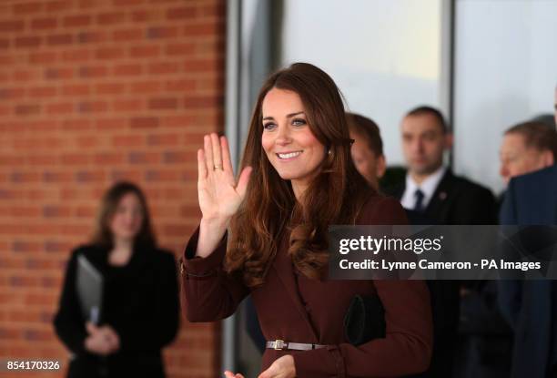 The Duchess of Cambridge is greeted by children from Havelock Academy, Grimsby, during her visit to the town.