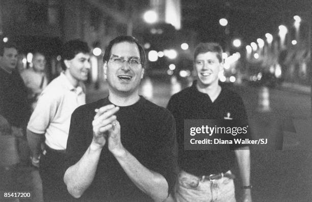 Apple Computer CEO Steve Jobs in Boston, after negotiating an Apple alliance w. Microsoft. Apple colleagues in the background, including Jim Oliver,...