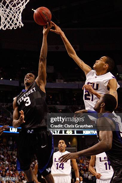 Kevin Galloway of the Kentucky Wildcats makes a shot over Chris Johnson of the Louisiana State University Tigers during the second round of the SEC...