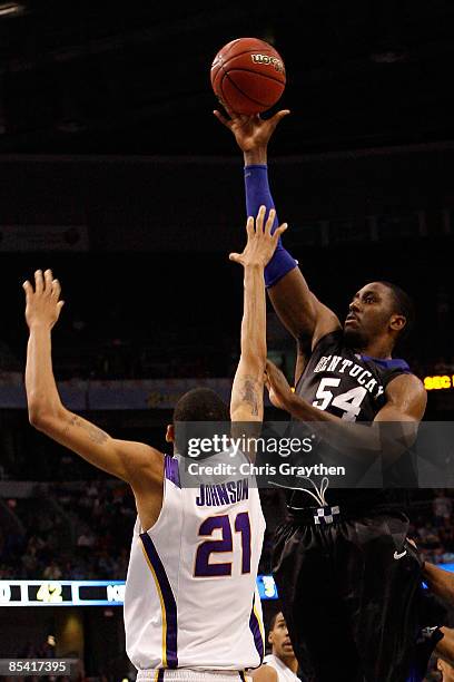 Patrick Patterson of the Kentucky Wildcats makes a shot over Chris Johnson of the Louisiana State University Tigers during the second round of the...