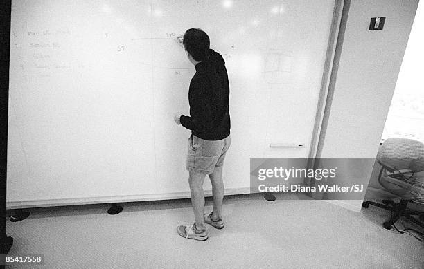 Apple Computer head Steve Jobs in boardroom at Apple HQ day before heading to Boston for MacWorld Expo to announce Apple's alliance w. Microsoft. In...