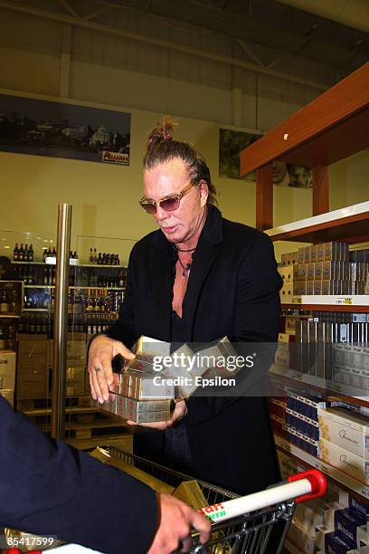 Actor Mickey Rourke buys cigarettes for prisoners before visiting a Butyrka jail in preparation to work on a new film on March 13, 2009 in Moscow,...