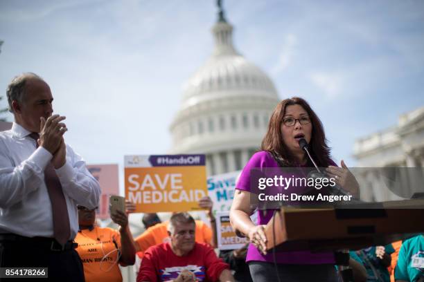 Sen.Chris Van Hollen looks on as Sen. Tammy Duckworth speaks during a news conference in opposition to the Graham-Cassidy health care bill, September...