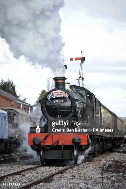 Locomotive GWR Prairie Class, number 5542 pulls out of Toddington station, taking Cheltenham racegoers to the festival in style aboard the At The...