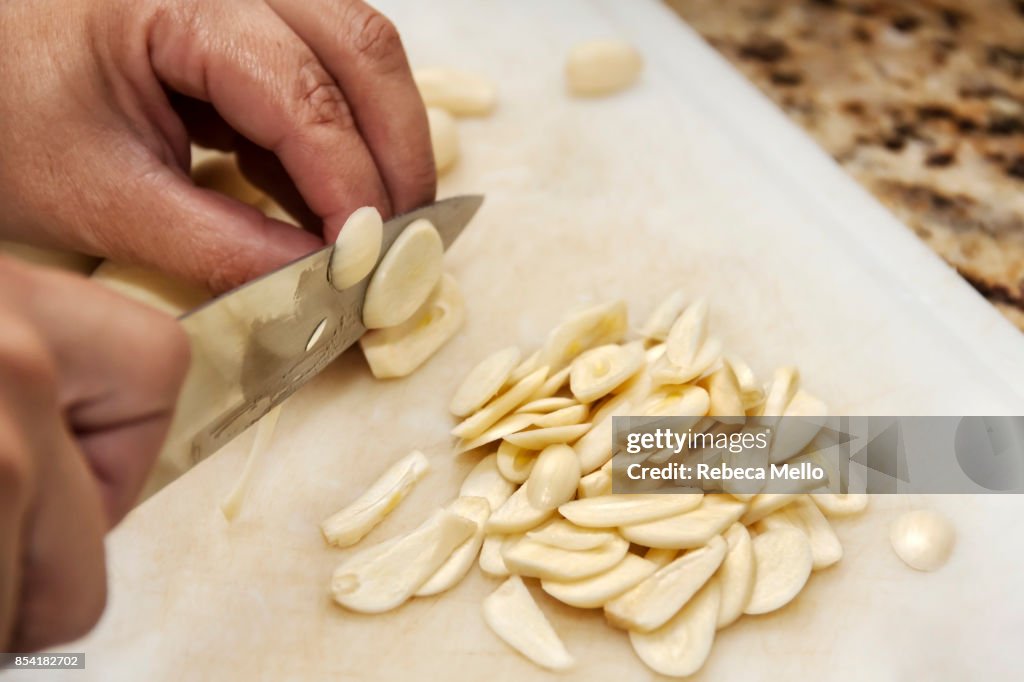 Slicing garlic on close-up