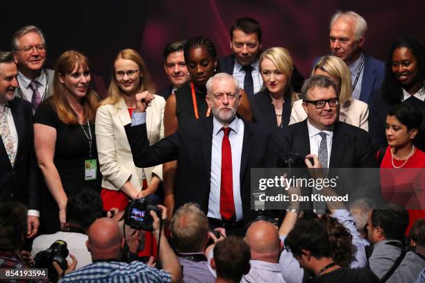 Labour party leader Jeremy Corbyn gestures to delegates in the main hall as Shadow Secretary of State for Education Angela Rayner , Deputy Labour...