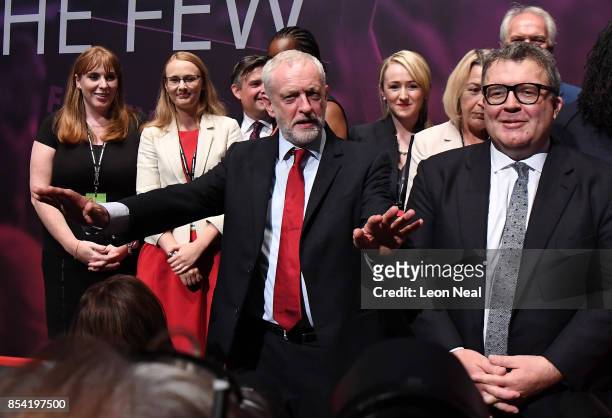 Labour party leader Jeremy Corbyn gestures as Shadow Secretary of State for Education Angela Rayner and Deputy Labour party leader Tom Watson look on...