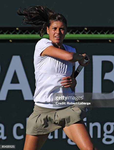 Sorana Cirstea returns to Elena Vesnina at the BNP Paribas Open at the Indian Wells Tennis Garden on March 13, 2009 in Indian Wells, California.