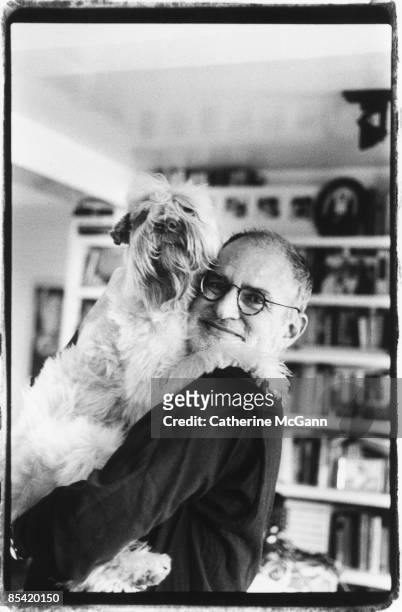 American playwright and gay rights activist Larry Kramer poses for a portrait with his dog at his apartment in April 1993 in New York City, New York.