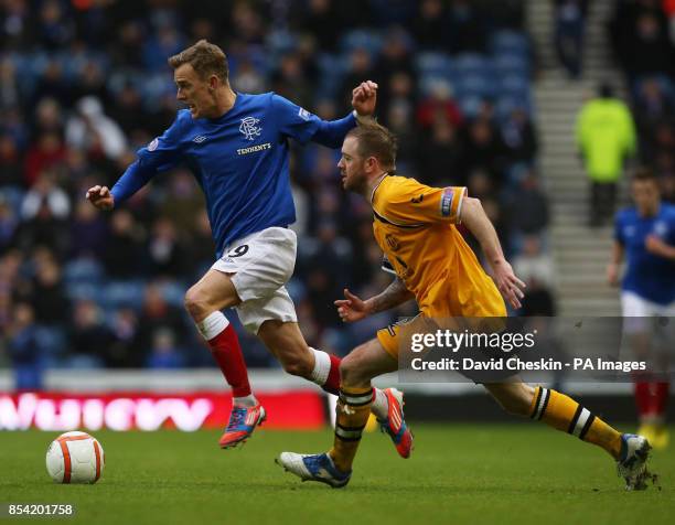 Rangers Dean Shiels holds off Annan Athletic's David Murray during the Irn-Bru Scottish Third Division match at Ibrox, Glasgow