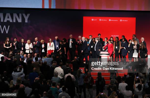 Labour party leader Jeremy Corbyn is applauded by Labour MP's as he leaves the stage in the main hall, on day three of the annual Labour Party...