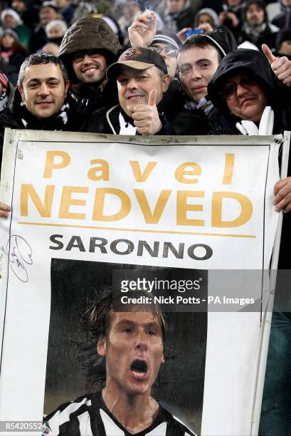 Juventus fans with a sign dedicated to former player and current board member Pavel Nedved