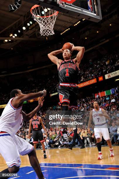 Derrick Rose of the Chicago Bulls dunks against the Philadelphia 76ers during the game on March 13, 2009 at the Wachovia Spectrum in Philadelphia,...