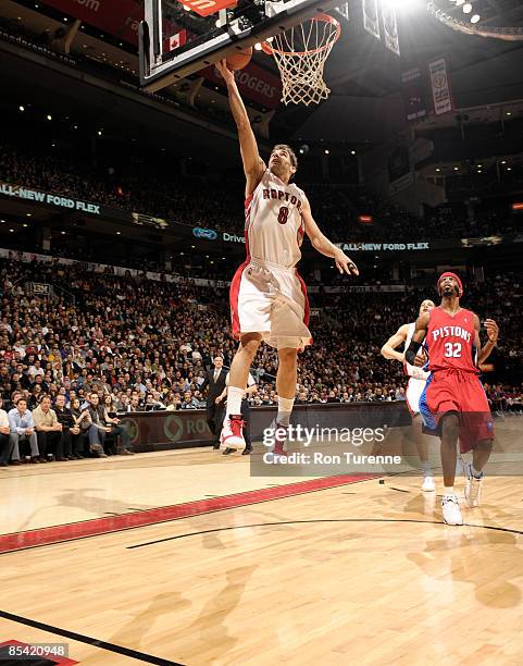 Jose Calderon of the Toronto Raptors finishes the fast break ahead of Richard Hamilton of the Detroit Pistons during a game on March 13, 2009 at the...