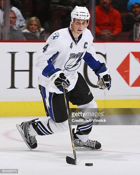 Vincent Lecavalier of the Tampa Bay Lightning skates up ice with the puck during the game against the Vancouver Canucks at General Motors Place on...
