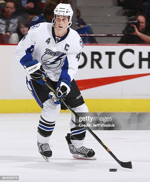 Vincent Lecavalier of the Tampa Bay Lightning skates up ice with the puck during the game against the Vancouver Canucks at General Motors Place on...