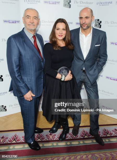 Producers Michael J Wilson and Barbara Broccoli, winners of the Film Award for 'Skyfall' with Mark Strong in the press room at the Sky Arts South...