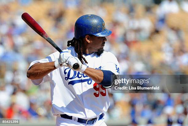 Manny Ramirez of the Los Angeles Dodgers at bat during a Spring Training game against the Texas Rangers on March 13, 2009 at Camelback Ranch in...