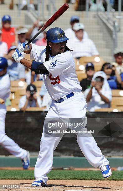 Manny Ramirez of the Los Angeles Dodgers at bat during a Spring Training game against the Texas Rangers on March 13, 2009 at Camelback Ranch in...