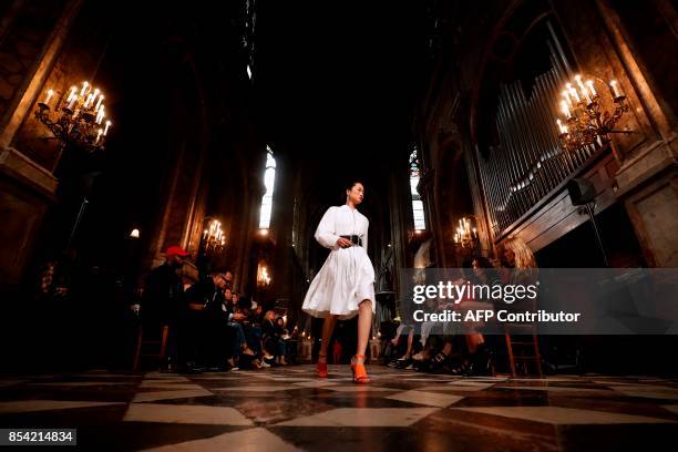 Model presents a creation for Koche during the women's 2018 Spring/Summer ready-to-wear collection fashion show in Paris, on September 26, 2017. /...