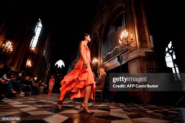 Model presents a creation for Koche during the women's 2018 Spring/Summer ready-to-wear collection fashion show in Paris, on September 26, 2017. /...